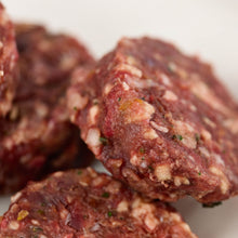 Close up of beef raw dog food patties from LUNA & me