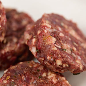 Close up of beef raw dog food patties from LUNA & me