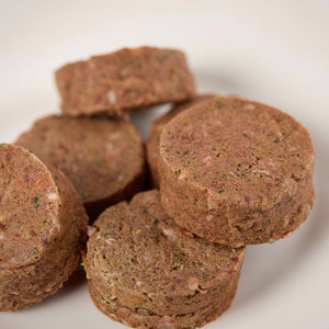 Close up of Puppy Power raw dog food patties from LUNA & me