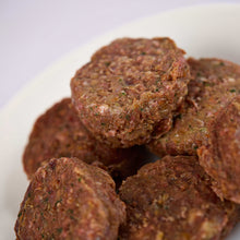 Close up of raw dog food patties from LUNA & me