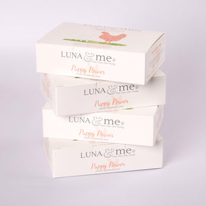 Four stacked boxes filled with LUNA & me Puppy Power raw dog food mince 